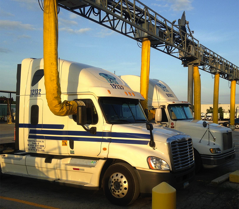 Photo of trucks parked at electrified parking spaces