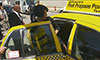 Photo of a woman entering a taxi