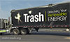 Photo of large trailer truck with text painted on the side that says Trash, Unlocking Your Renewable Energy 